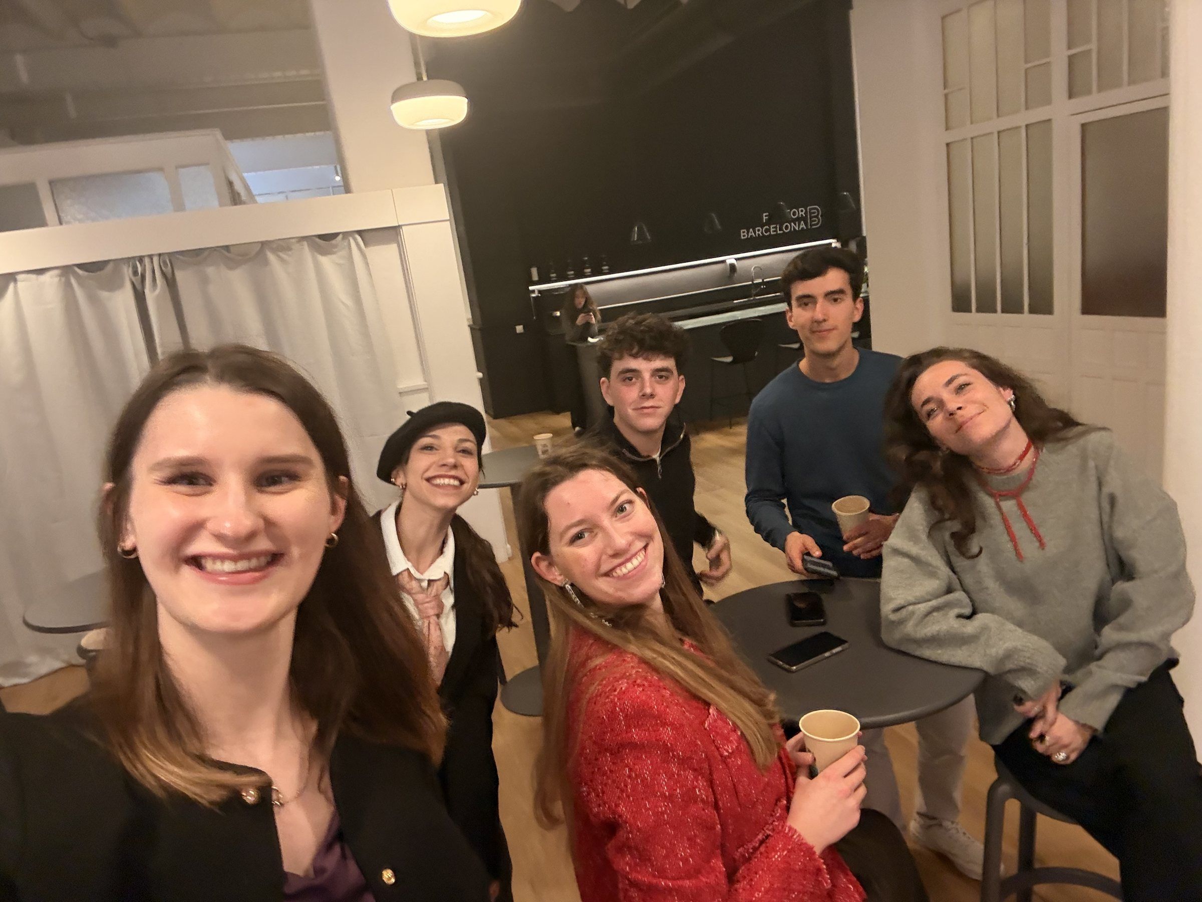Selfie of smiling members around a table after Road to START Summit